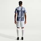 Haut de foot à manches courtes d'avant-match Nike Dri-FIT Pologne 2026 Avant-match pour homme