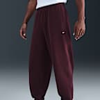 Pants de tejido Fleece con puños para hombre Nike Solo Swoosh
