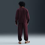 Pants de tejido Fleece con puños para hombre Nike Solo Swoosh