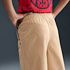 Vävda byxor med vida ben Nike Sportswear för ungdom (tjejer)