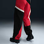 Pants de tejido Woven de tiro medio holgados con dobladillo abierto para mujer Nike Sportswear