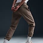 Pants de entrenamiento de tiro medio para mujer Nike Sportswear Phoenix Fleece