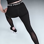 Nike Pro Leggings de 7/8 de talle medio con estampado y paneles de malla - Mujer