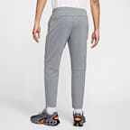 Pants de alto rendimiento Dri-FIT de pierna entallada con protección UV para hombre Nike Primary Fleece