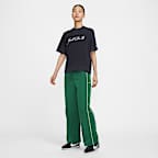 กางเกงขายาวเอวสูงเปิดชายแบบทอผู้หญิง Nike Windrunner