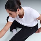 Pantaloni in fleece a vita media Therma-FIT Nike One – Donna