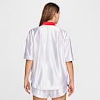 Playera de básquetbol Nike de temporada para mujer USA Village