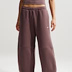 Pantalones entubados de tiro medio holgados para mujer Nike Sportswear Phoenix Fleece
