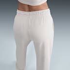 Pants de entrenamiento de French Terry oversized de tiro alto para mujer Nike Sportswear Phoenix Fleece