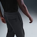 Pants de tejido Fleece de ajuste holgado con dobladillo abierto para hombre Nike Tech