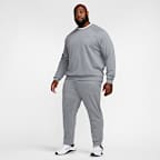 Pants de alto rendimiento Dri-FIT de pierna entallada con protección UV para hombre Nike Primary Fleece