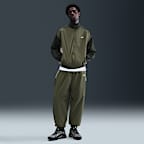 Vävd träningsjacka Nike Club i oversize-modell för män