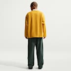 Męskie spodnie z dzianiny z luźnymi nogawkami Nike Solo Swoosh