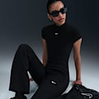 Maskinstrikkede Nike Sportswear Windrunner-bukser med mellemhøj talje og slank pasform til kvinder