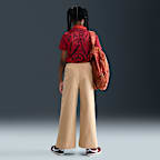 Vävda byxor med vida ben Nike Sportswear för ungdom (tjejer)