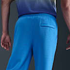Pants de tejido Fleece con dobladillo abierto para hombre Nike Club