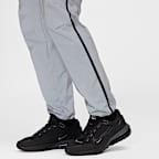 Pants de tejido Woven con diseño reflejante para hombre Nike Tech