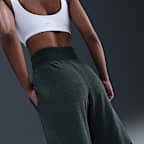 Pants de tejido Fleece cálidos de piernas anchas y tiro alto para mujer Nike Sportswear Phoenix Plush