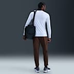 Pants versátiles Dri-FIT de pierna entallada para hombre Nike Unlimited