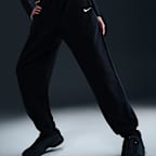 Pants de entrenamiento de French Terry oversized de tiro alto para mujer Nike Sportswear Phoenix Fleece