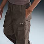 Pants cargo de tiro medio para mujer Nike Sportswear Everything Wovens