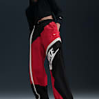 Pants de tejido Woven de tiro medio holgados con dobladillo abierto para mujer Nike Sportswear