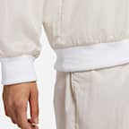 ナイキ スポーツウェア エッセンシャル ウィメンズ ルーズ UV ウーブン ロングスリーブ Vネック トップ