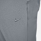 Pants versátiles Dri-FIT de pierna entallada para hombre Nike Unlimited