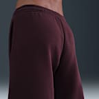 Pantalones entubados de tiro medio holgados para mujer Nike Sportswear Phoenix Fleece