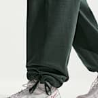 Męskie spodnie z dzianiny z luźnymi nogawkami Nike Solo Swoosh