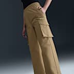 กางเกงคาร์โก้ขายาวเอวปานกลางผู้หญิง Nike Sportswear Everything Wovens