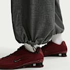 Pants de tejido Woven de tiro medio oversized para mujer Nike Sportswear