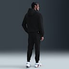 NikeCourt Heritage Dri-FIT tennisjoggingbroek van fleece voor heren