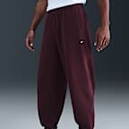 Pants de tejido Fleece con puños para hombre Nike Solo Swoosh