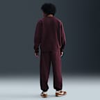 Pants de tejido Fleece con puños para hombre Nike Solo Swoosh