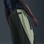 Pánské volnější tkané kalhoty Nike Tech Dri-FIT s barevnými díly