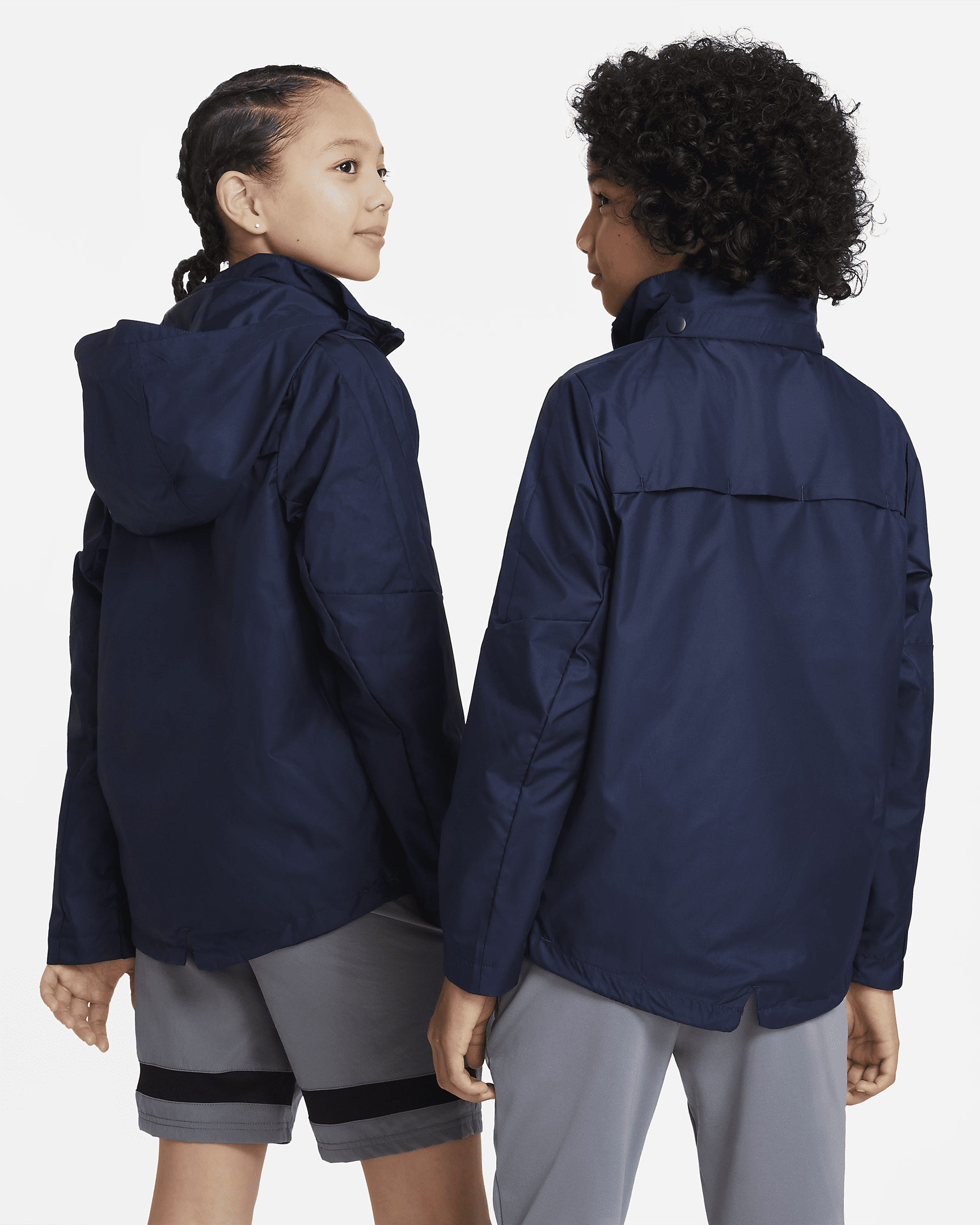 Nike Storm-FIT Academy23 Older Kids' Football Rain Jacket. Nike AE