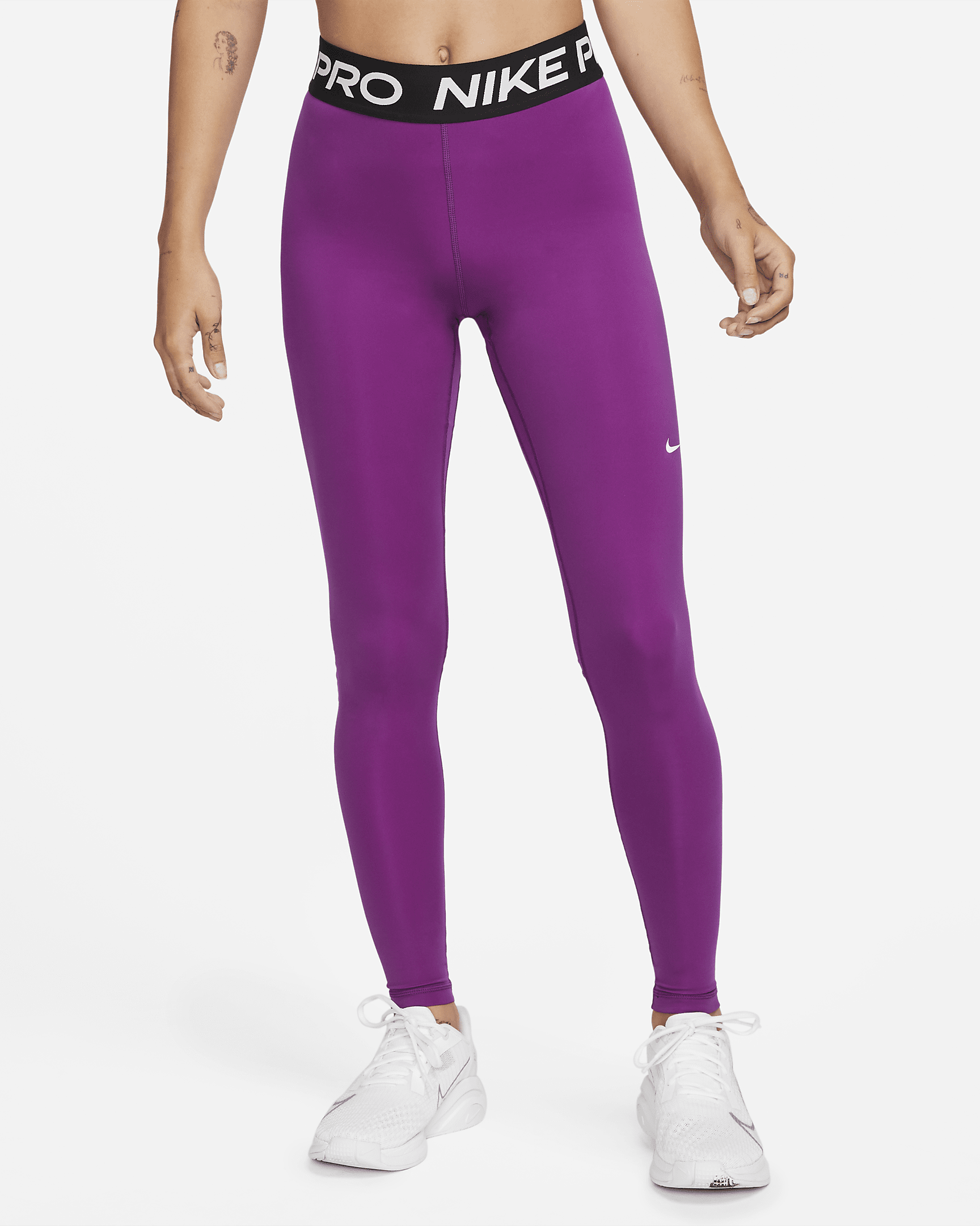 Nike Pro Legging met halfhoge taille en mesh vlakken voor dames. Nike BE