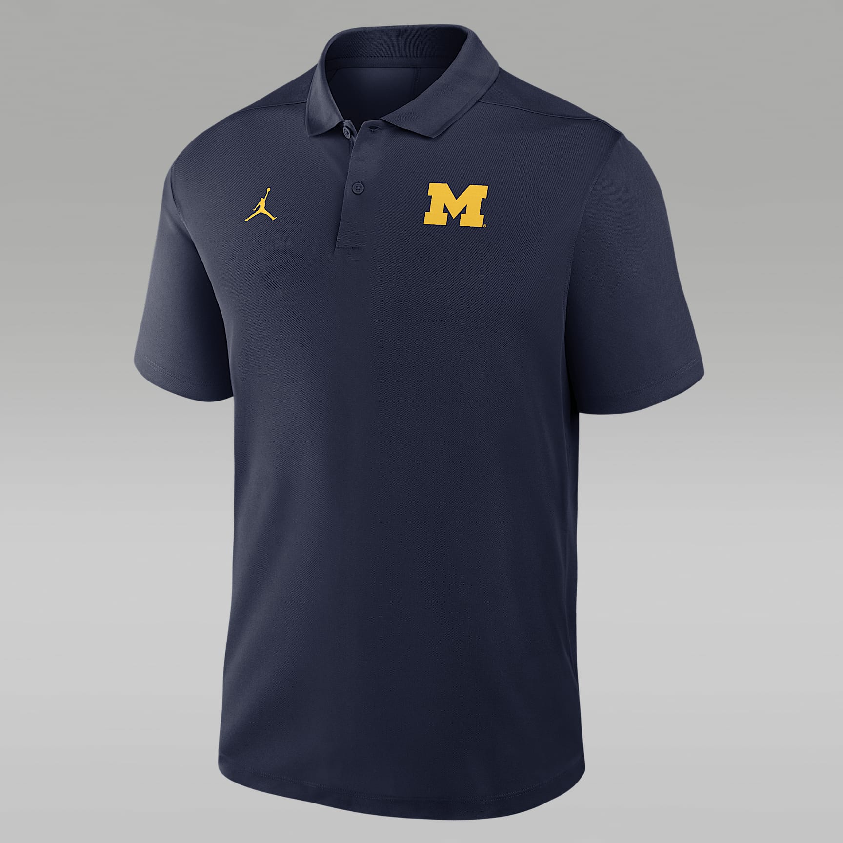 Polo universitaria Nike Dri-FIT para hombre Michigan Victory