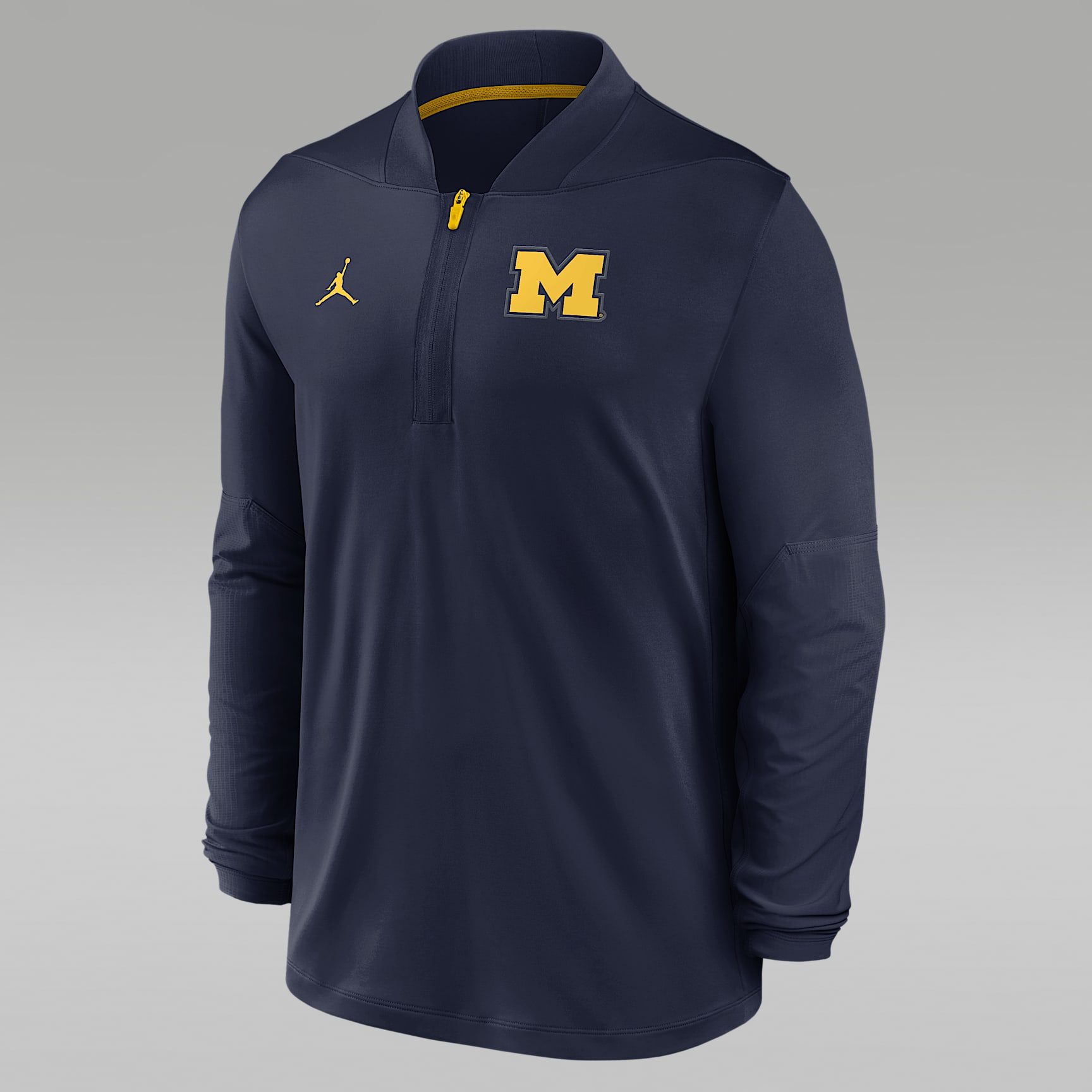 Playera universitaria marca Jordan Dri-FIT de medio cierre para hombre Michigan Sideline