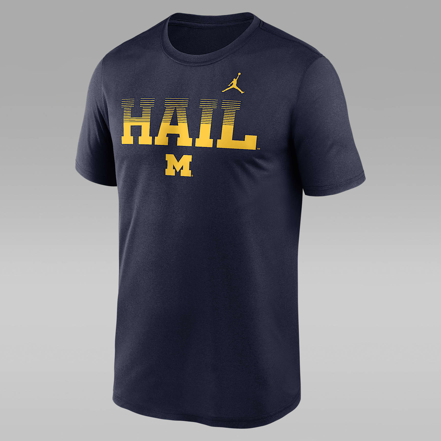 Playera universitaria Nike Dri-FIT para hombre Michigan Kinetic Mantra Legend