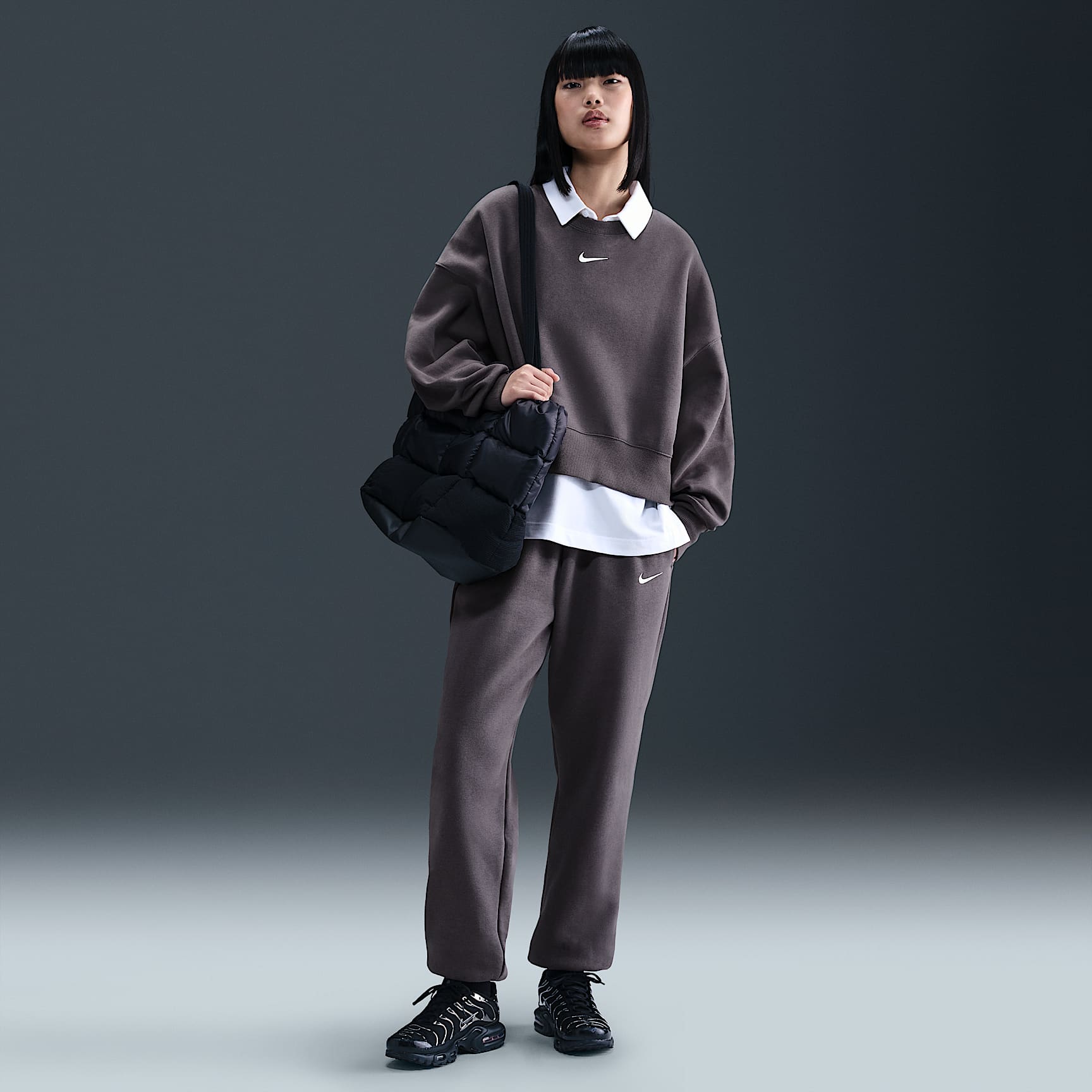 Pants de entrenamiento oversized de tiro alto para mujer Nike Sportswear Phoenix Fleece