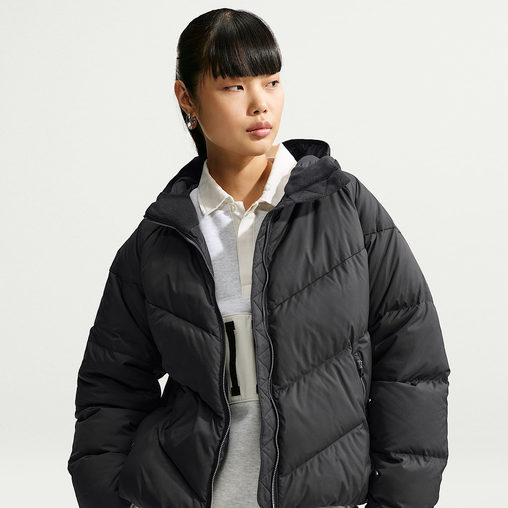 Giacca in piumino ampia con cappuccio Storm-FIT Nike Sportswear Windpuffer – Donna
