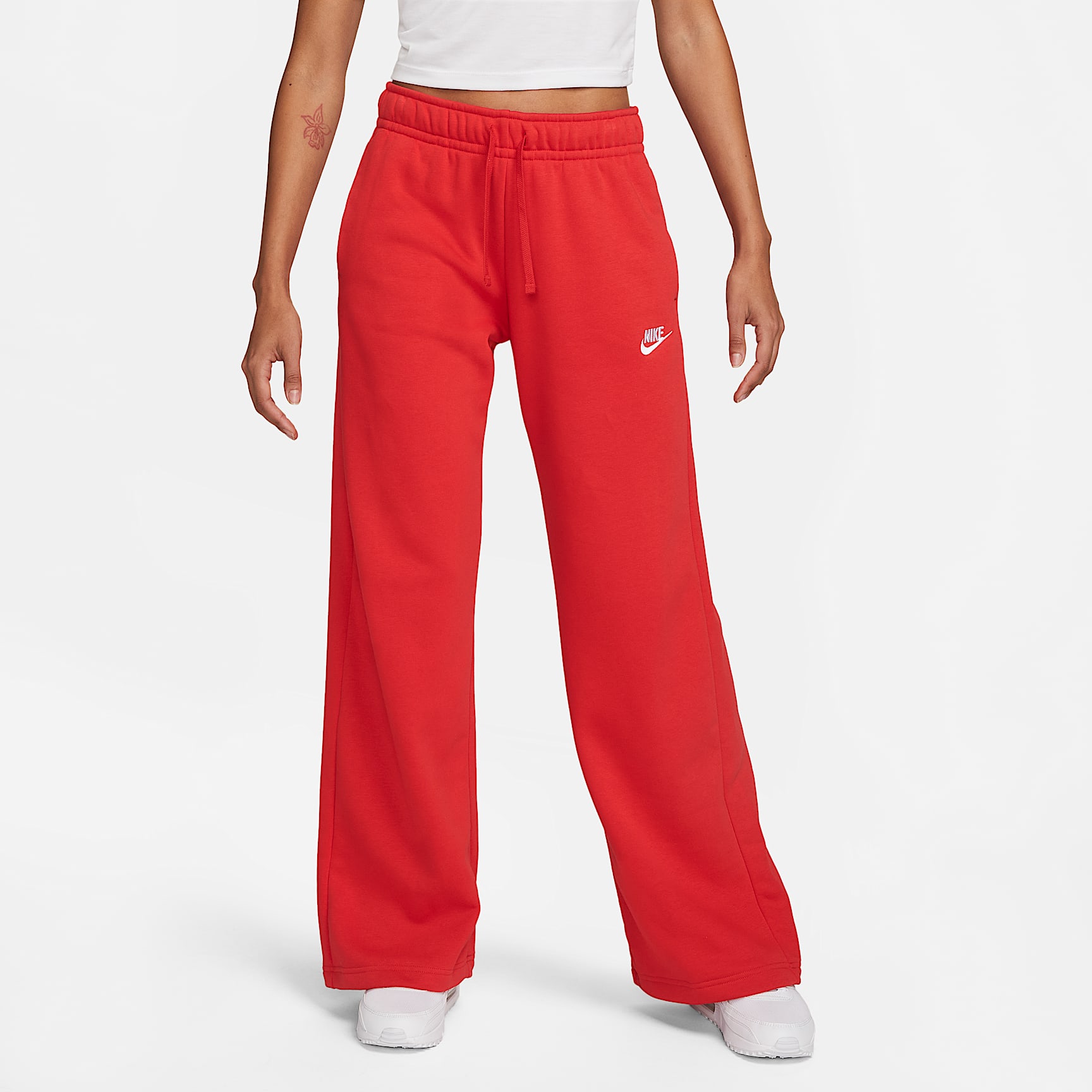 Pants de entrenamiento de piernas anchas de tiro medio para mujer Nike Sportswear Club Fleece
