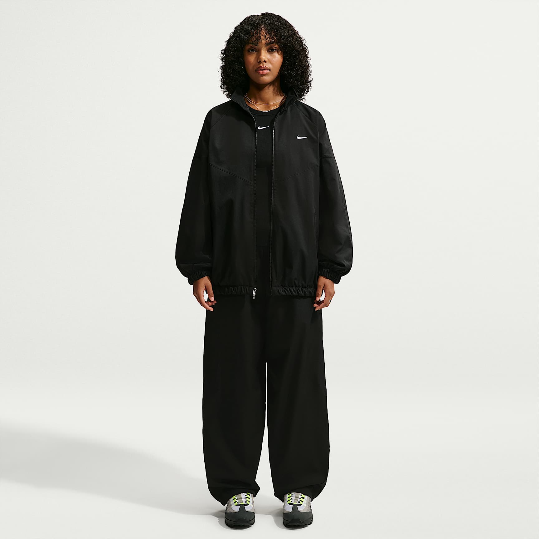 Pants deportivos de tiro alto holgados para mujer Nike Sportswear