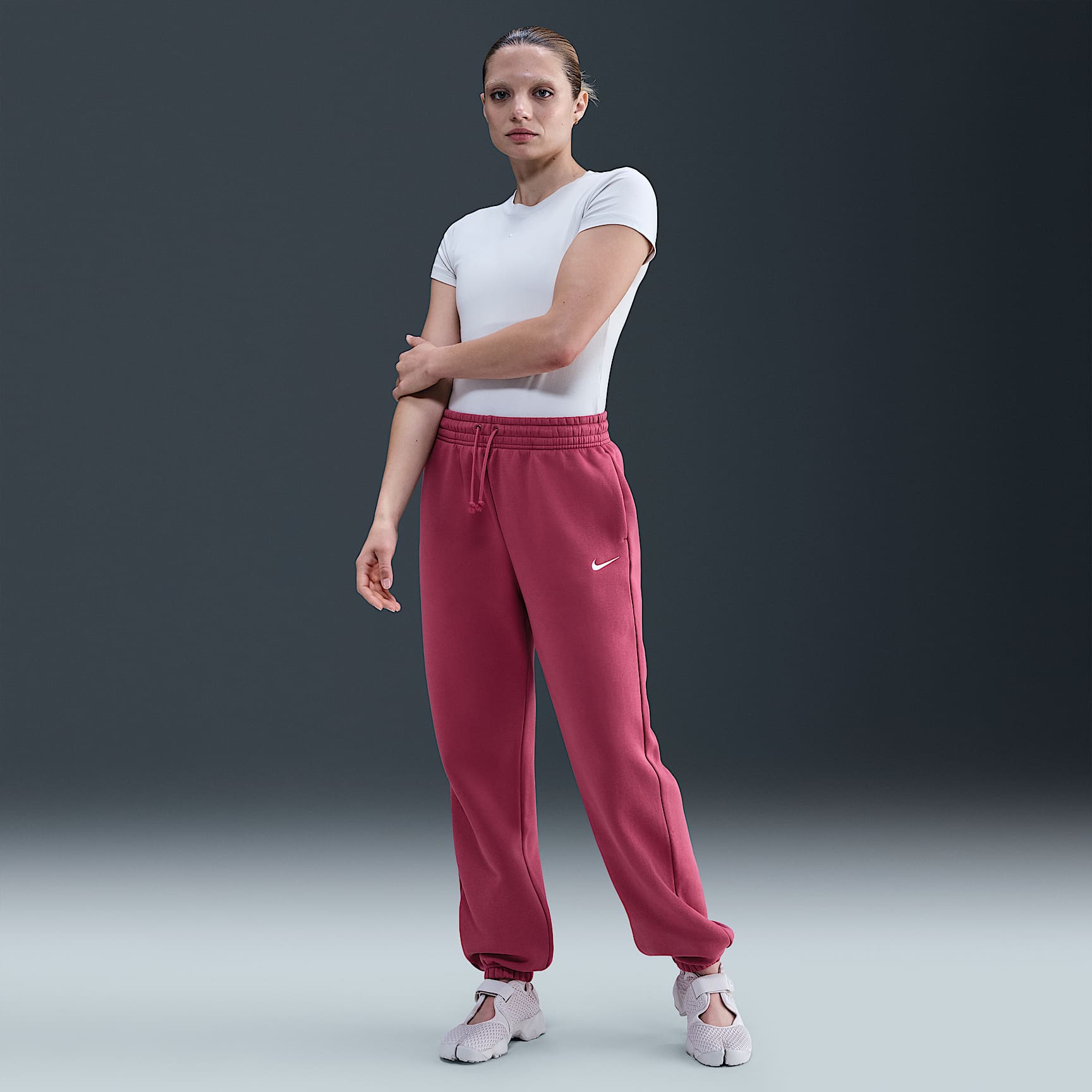 Pants de entrenamiento oversized de tiro alto para mujer Nike Sportswear Phoenix Fleece