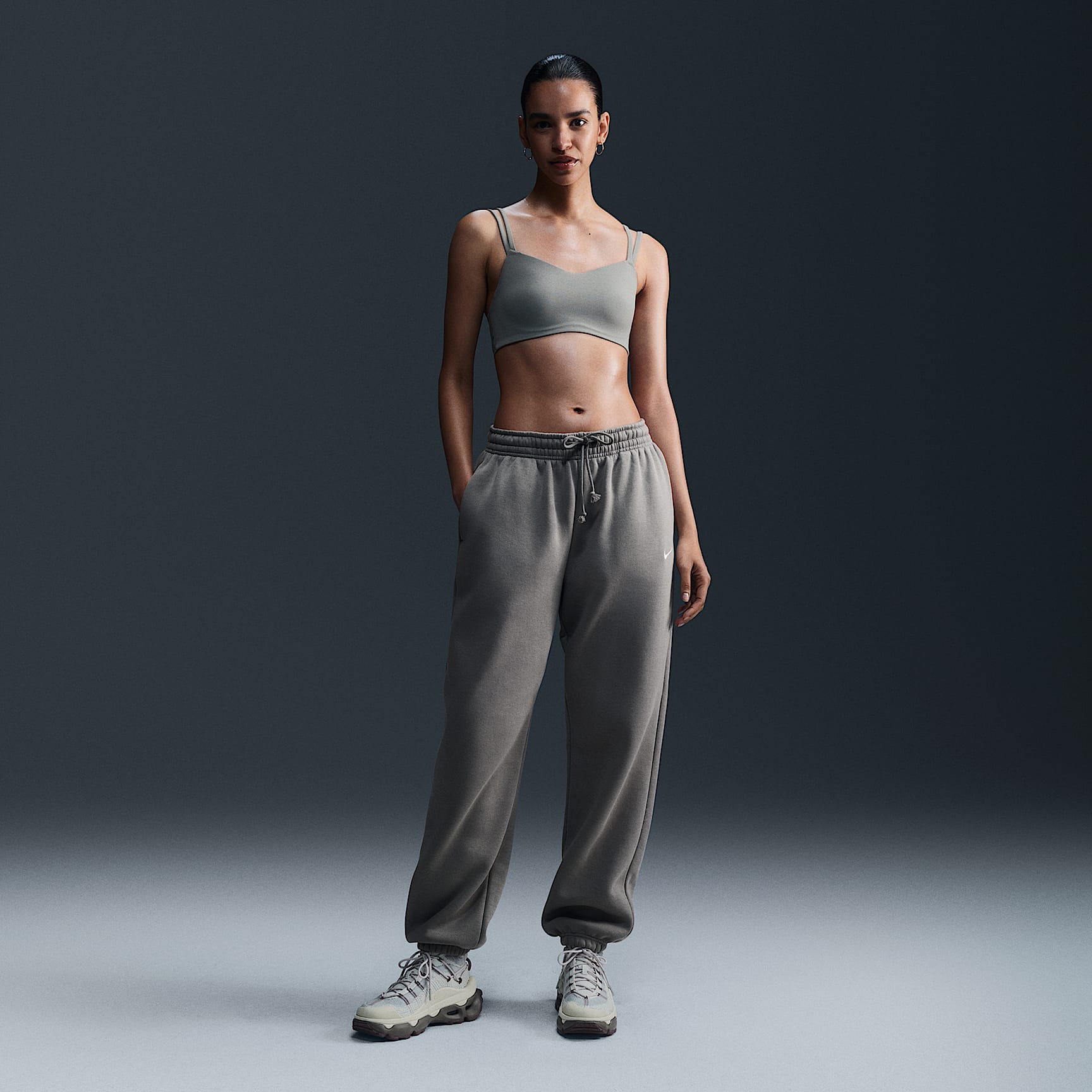Pants de entrenamiento oversized de tiro alto para mujer Nike Sportswear Phoenix Fleece