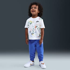 Conjunto de playera y pants Reveal estampado infantil Nike Sportswear