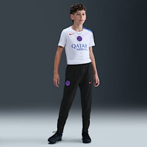 Paris Saint-Germain Strike harmadik Nike Dri-FIT Total 90 kötött futballnadrág nagyobb gyerekeknek