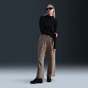 Pants de French Terry de tiro medio oversized con dobladillo abierto para mujer Nike Sportswear